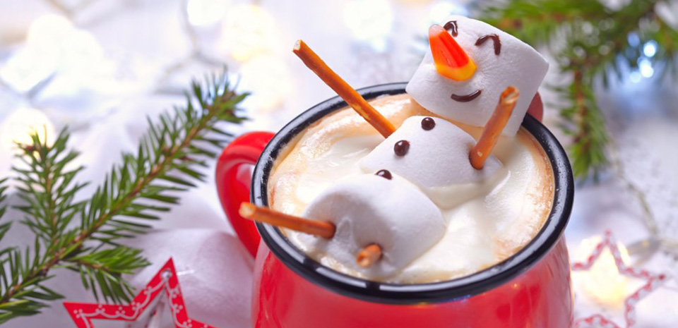 Red mug with hot chocolate and a melted marshmallow snowman