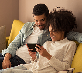 Photo of couple using phone