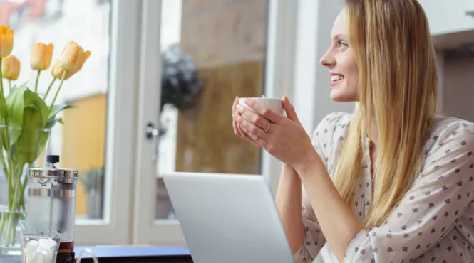 woman with mug enjoying micro practice of mindfulness before an online meeting
