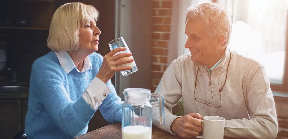 elderly couple enjoying breakfast