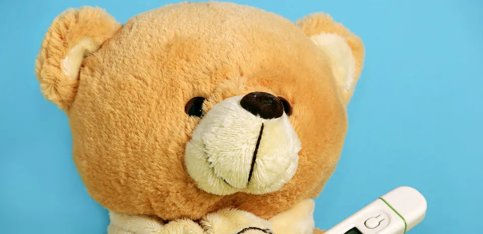 teddy bear getting temperature taken