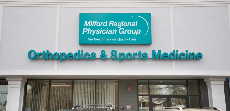 The "Orthopedics and Sports Medicine" sign on the exterior of the building.
