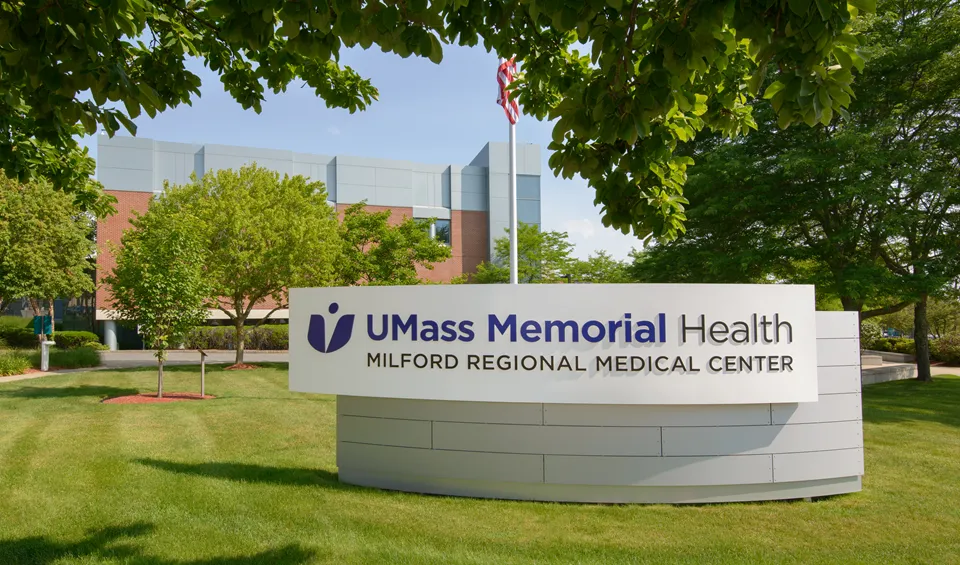 The front sign for UMass Memorial Health - Milford Regional Medical Center on a sunny day.