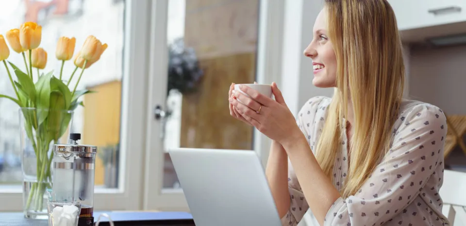 woman with mug enjoying micro practice of mindfulness before an online meeting