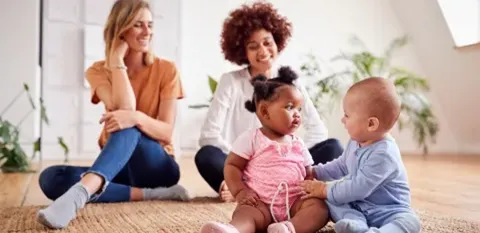 moms having a play date with babies