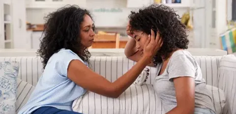 mom helping daughter cope