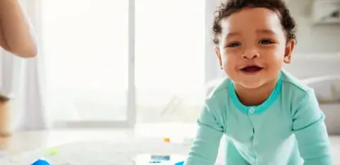 baby crawling on floor