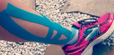 kinesiology tape on women's leg