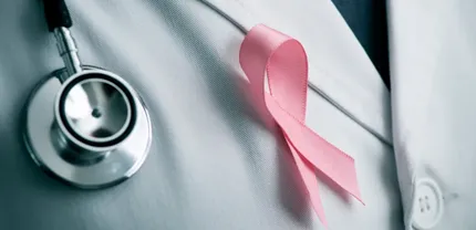 Pink ribbon symbolizing breast cancer awareness month, promoting education and support for those affected by the disease.