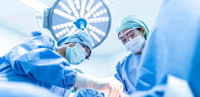 surgeons operating on patient in the operating room 