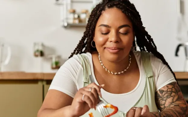 Women at a table eating mindfully enjoying each bite of food
