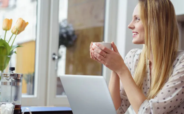 woman with mug enjoying micro practice of mindfulness before an online meeting