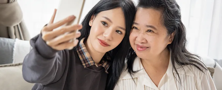 mom and daughter taking selfie photo