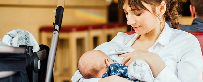 new mom breastfeeding newborn in public
