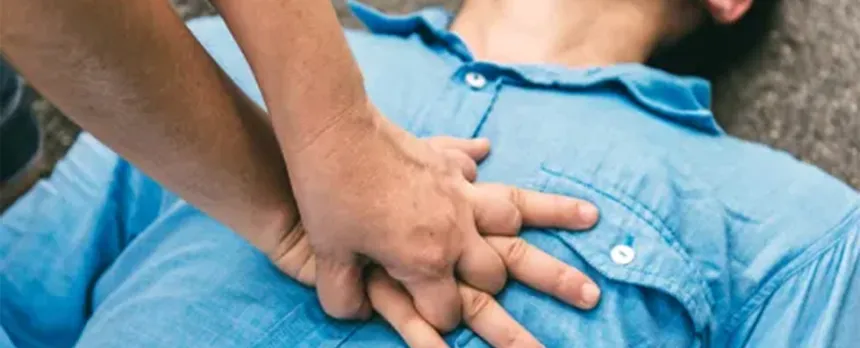person giving CPR chest compressions