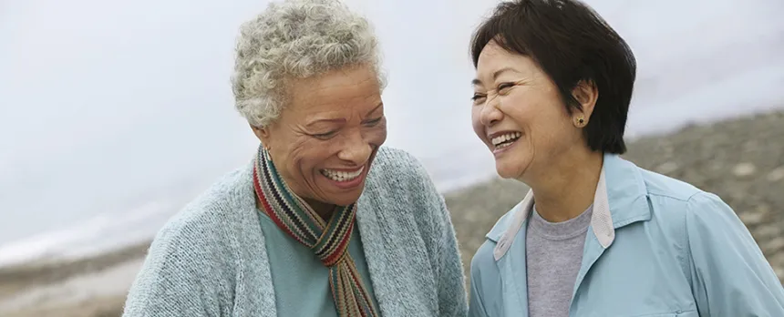 two elder women enjoying time together and laughing 