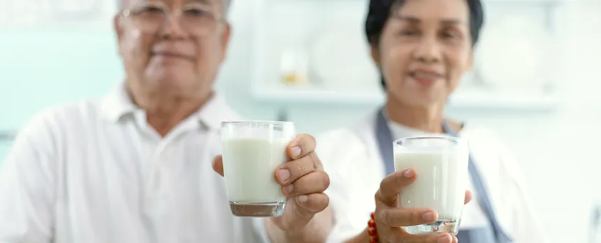 asian elderly couple drinking milk