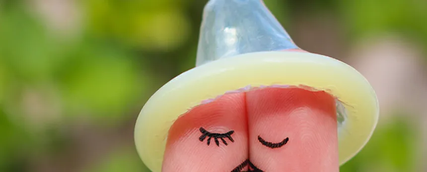 condom on top of fingers to look like hat