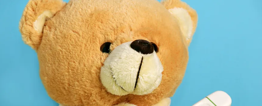 teddy bear getting temperature taken