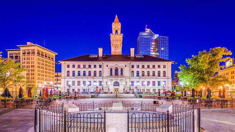 The Worcester City Hall is shown against a blue sky.