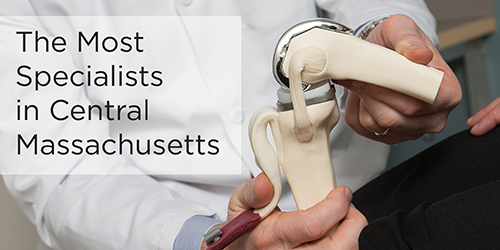 A closeup shows a doctor with a skeletal model and the text 'The Most Specialists in Central Massachusetts.'