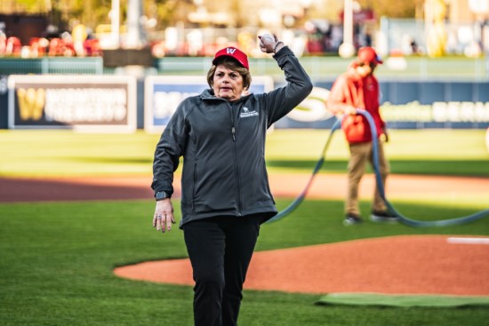 Candy Szymanski, RN, AVP, Hospital at Home Program, throws out the first pitch at the Woo Sox games during Nurses Week