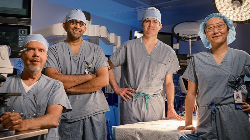 The Robotic One Anesthetic Diagnosis and Treatment team standing in the operating room
